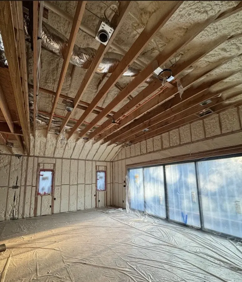 Interior walls and ceiling insulated with spray foam during new construction in Lincoln