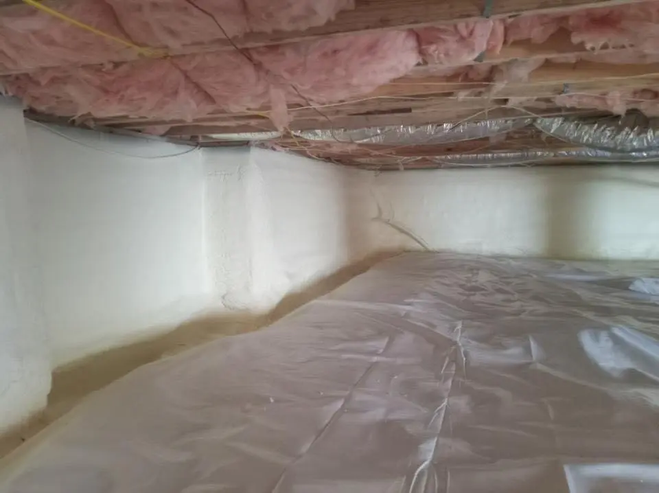 Crawl space encapsulation with closed-cell spray foam for Commercial Roof Restoration in Lincoln